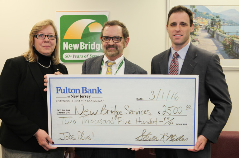 Check presented to NewBridge CEO Robert Parker